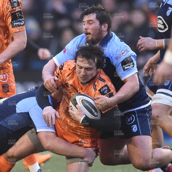 261219 - Cardiff Blues v Dragons - Guinness PRO14 - Rhodri Williams of Dragons is tackled by Keiron Assiratti of Cardiff Blues  and Liam Belcher of Cardiff Blues 