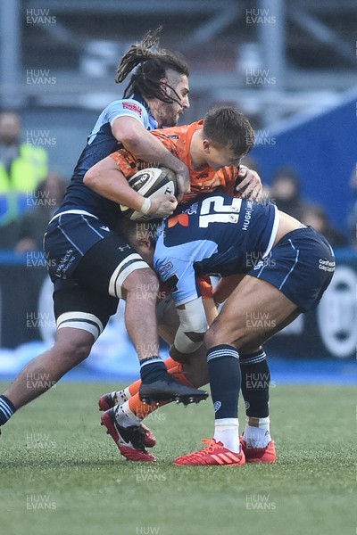 261219 - Cardiff Blues v Dragons - Guinness PRO14 - Will Talbot-Davies of Dragons is tackled by Josh Navidi of Cardiff Blues  and Ben Thomas of Cardiff Blues 