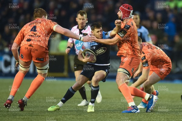 261219 - Cardiff Blues v Dragons - Guinness PRO14 - Tomos Williams of Cardiff Blues is tackled by Cory Hill of Dragons 