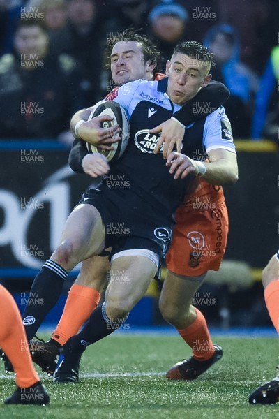 261219 - Cardiff Blues v Dragons - Guinness PRO14 - Josh Adams of Cardiff Blues is tackled by Rhodri Williams of Dragons 