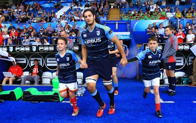 290815 - Cardiff Blues v Newport Gwent Dragons - Preseason friendly - Josh Navidi of Cardiff Blues leads the team out in the new strip