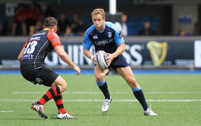 290815 - Cardiff Blues v Newport Gwent Dragons - Preseason friendly - Tom Isaacs of Cardiff Blues takes on Adam Warren of Dragons