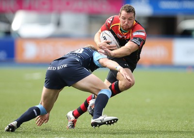 290815 - Cardiff Blues v Newport Gwent Dragons, Pre-Season Friendly -Adam Warren of Newport Gwent Dragons looks to get past Tom Isaacs of Cardiff Blues