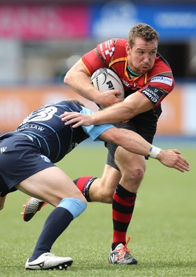 290815 - Cardiff Blues v Newport Gwent Dragons, Pre-Season Friendly -Adam Warren of Newport Gwent Dragons looks to get past Tom Isaacs of Cardiff Blues