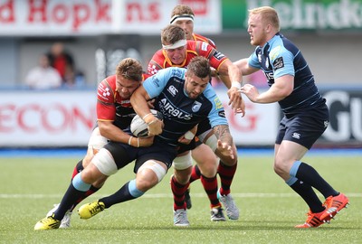 290815 - Cardiff Blues v Newport Gwent Dragons, Pre-Season Friendly -Josh Turnbull of Cardiff Blues is tackled by Lewis Evans of Newport Gwent Dragons