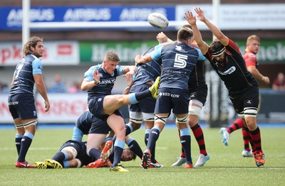 290815 - Cardiff Blues v Newport Gwent Dragons, Pre-Season Friendly -Cory Hill of Newport Gwent Dragons looks to charge down the kick from Tavis Knoyle of Cardiff Blues