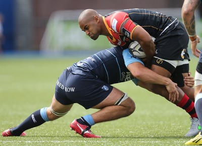 290815 - Cardiff Blues v Newport Gwent Dragons, Pre-Season Friendly -Aled Brew of Newport Gwent Dragons is tackled by Josh Navidi of Cardiff Blues