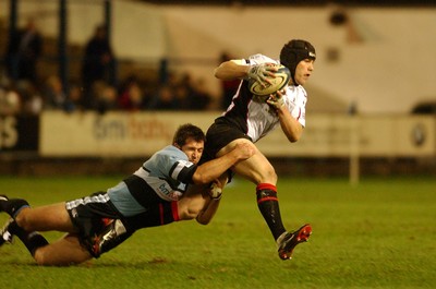 280105 - Cardiff Blues v Edinburgh - Celtic League - Edinburgh's Simon Webster tries to get through