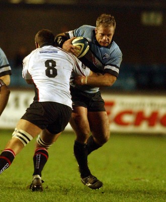 280105 - Cardiff Blues v Edinburgh - Celtic League - Blues Jon Bryant takes on David Callum