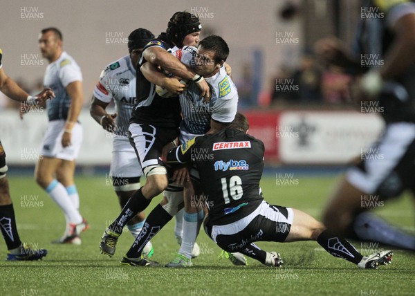 150814 - Cardiff Blues v Exeter - Pre Season Friendly - Ellis Jenkins of Cardiff Blues is tackled by Ben White of Exeter Chiefs and Elvis Taione of Exeter Chiefs 