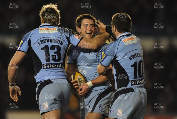 20.02.09 - Cardiff Blues v Glasgow - Magners League - Cardiff's Dafydd Hewitt celebrates his try with Jamie Robinson and Ceri Sweeney. 