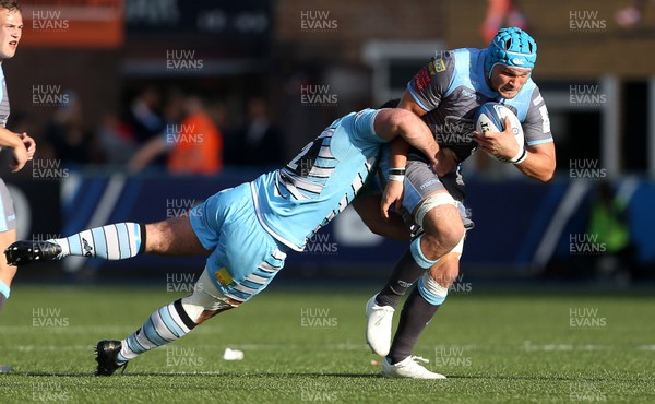 211018 - Cardiff Blues v Glasgow Warriors - Heineken Champions Cup - Olly Robinson of Cardiff Blues is tackled by Fraser Brown of Glasgow Warriors
