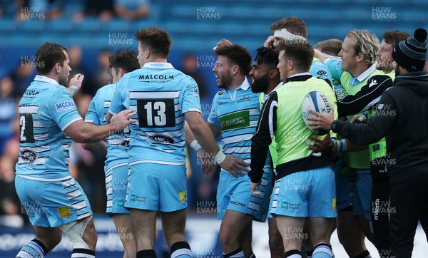 211018 - Cardiff Blues v Glasgow Warriors - Heineken Champions Cup - Ali Price of Glasgow Warriors celebrates scoring a try with team mates