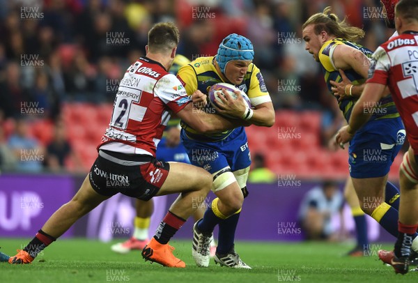 110518 - Cardiff Blues v Gloucester - European Rugby Challenge Cup Final - Olly Robinson of Cardiff Blues is tackled by Mark Atkinson of Gloucester
