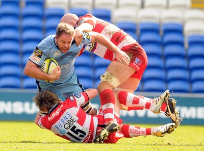 14.03.10 - LV= Cup Rugby, semi final. Cardiff Blues v Gloucester Rugby Blues' Xavier Rush is brought down by Gloucester's Freddie Burns and Will James 