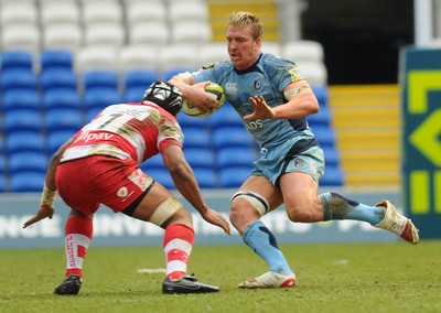 14.03.10 - LV= Cup Rugby, Cardiff Blues v Gloucester Rugby Blues' Andy Powell looks for a way past Gloucester's Akapusi Qera 