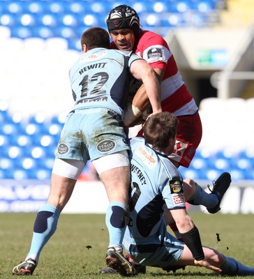 14.03.10 ... Cardiff Blues v Gloucester, LV= Cup Semi Final -  Gloucester's Akapusi Qera is tackled by Blues' Dafydd Hewitt and Ceri Sweeney 