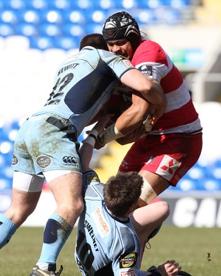 14.03.10 ... Cardiff Blues v Gloucester, LV= Cup Semi Final -  Gloucester's Akapusi Qera is tackled by Blues' Dafydd Hewitt and Ceri Sweeney 