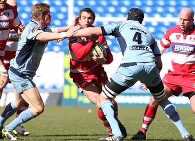 14.03.10 ... Cardiff Blues v Gloucester, LV= Cup Semi Final -  Gloucester's Nicky Robinson is tackled by Blues' Scott Morgan and T Rhys Thomas  