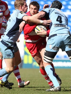 14.03.10 ... Cardiff Blues v Gloucester, LV= Cup Semi Final -  Gloucester's Nicky Robinson is tackled by Blues' Scott Morgan and T Rhys Thomas  