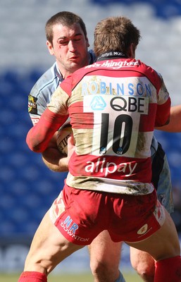 14.03.10 ... Cardiff Blues v Gloucester, LV= Cup Semi Final -  Blues' Dafydd Hewitt is tavkled by Gloucester's Nicky Robinson 