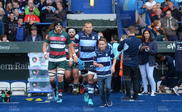 110818 - Cardiff Blues v Leicester Tigers - Preseason Friendly - Olly Robinson of Cardiff Blues with mascot