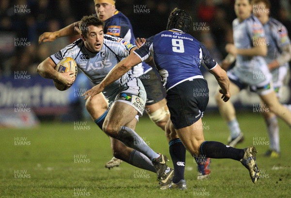 080213 - Cardiff Blues v Leinster, RaboDirect PRO12 - Cardiff Blues' Dafydd Hewitt looks to hold off Leinster's Isaac Boss 