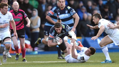 100115 - Cardiff Blues v Leinster - Guinness PRO12 -Alex Cuthbert of Cardiff Blues is tackled by Luke McGrath of Leinster