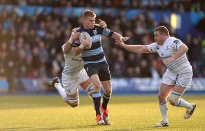 100115 - Cardiff Blues v Leinster - Guinness PRO12 -Gareth Anscombe of Cardiff Blues is tackled by Dominic Ryan and Sean Cronin of Leinster