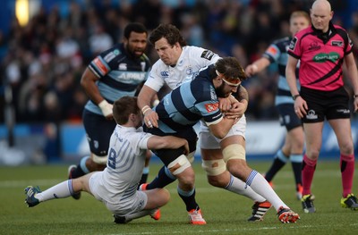 100115 - Cardiff Blues v Leinster - Guinness PRO12 -Josh Turnbull of Cardiff Blues is tackled by Luke McGrath and Tom Denton of Leinster