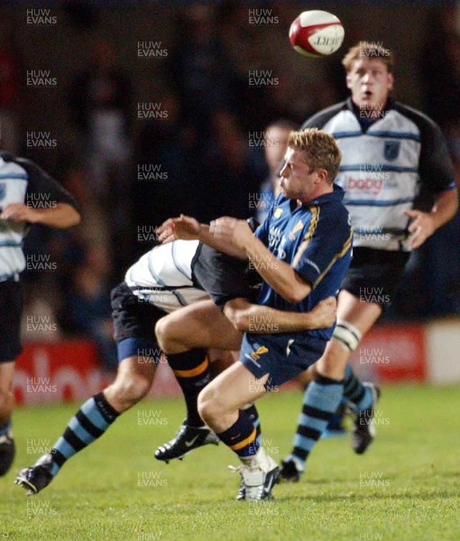 101003 - Cardiff Blues v Leinster - Blues' Matt Allen catches Gary Brown unawares as he spills ball in tackle