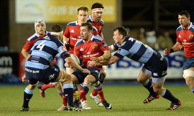 011114 - Cardiff Blues v Munster - Guiness PRO12 -JJ Hanrahan of Munster is tackled by Matthew Rees of Cardiff Blues