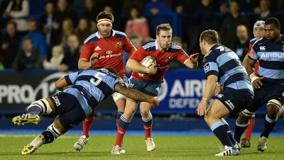 011114 - Cardiff Blues v Munster - Guiness PRO12 -JJ Hanrahan of Munster is tackled by Filo Paulo and Sam Hobbs of Cardiff Blues