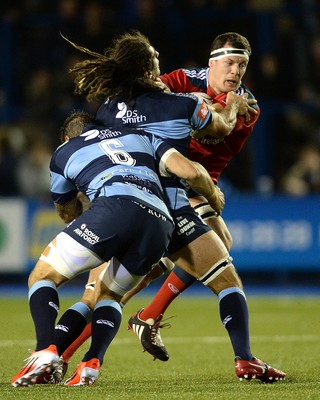 011114 - Cardiff Blues v Munster - Guiness PRO12 -Robin Copeland of Munster is tackled by Josh Turnbull and Josh Navidi of Cardiff Blues