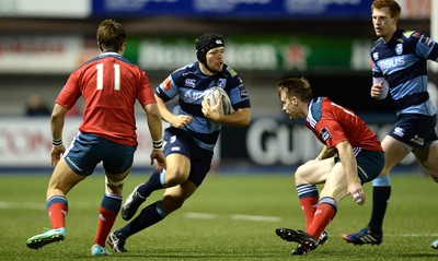 011114 - Cardiff Blues v Munster - Guiness PRO12 -Adam Thomas of Cardiff Blues is tackled by Rory Scannell of Munster