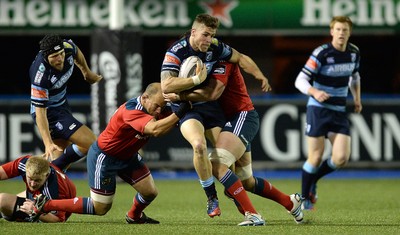 011114 - Cardiff Blues v Munster - Guiness PRO12 -Gavin Evans of Cardiff Blues is tackled by BJ Botha and Robin Copeland of Munster