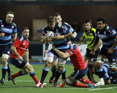 011114 - Cardiff Blues v Munster - GuinnessPro12 -Josh Turnbull of The Blues is tackled by Billy Holland of Munster