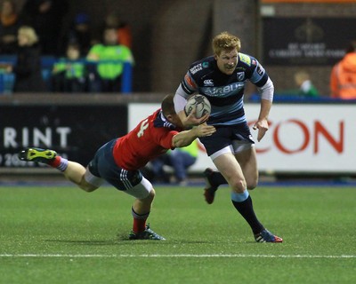 011114 - Cardiff Blues v Munster - GuinnessPro12 -Rhys Patchell of The Blues is tackled by Andrew Conway of Munster