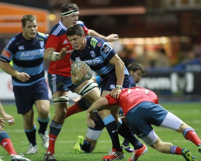 011114 - Cardiff Blues v Munster - GuinnessPro12 -Richard Smith of The Blues takes on Andrew Conway of Munster