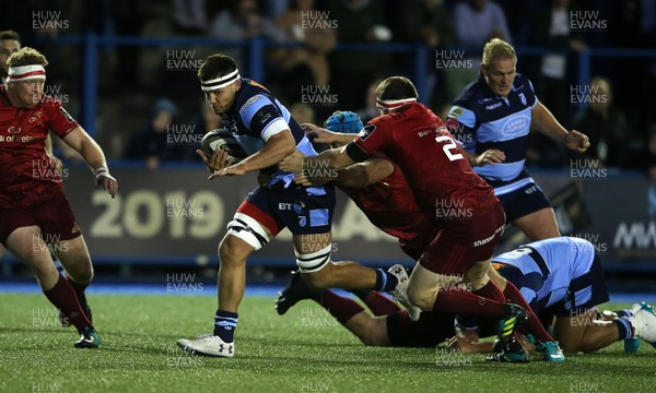 210918 - Cardiff Blues v Munster - Guinness PRO14 - Ellis Jenkins of Cardiff Blues is tackled by Tadhg Beirne and Mike Sherry of Munster