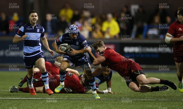 210918 - Cardiff Blues v Munster - Guinness PRO14 - Matthew Morgan of Cardiff Blues is tackled by Chris Cloete of Munster