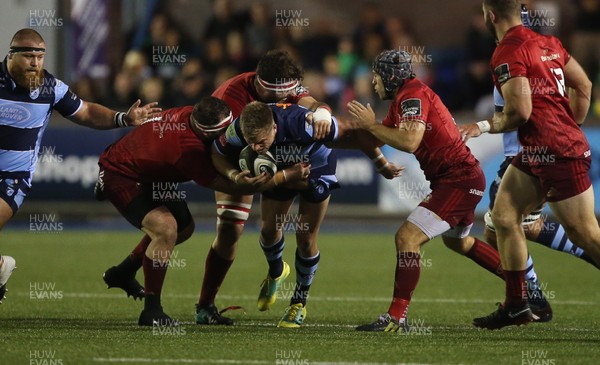 210918 - Cardiff Blues v Munster - Guinness PRO14 - Gareth Anscombe of Cardiff Blues is tackled by James Cronin and Jean Kleyn of Munster