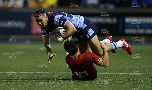 210918 - Cardiff Blues v Munster - Guinness PRO14 - Jason Harries of Cardiff Blues is tackled by Joey Carbery of Munster