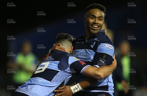 210918 - Cardiff Blues v Munster - Guinness PRO14 - Tomos Williams celebrates with Willis Halaholo of Cardiff Blues after scoring a try