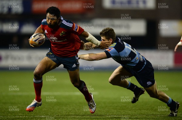 231113 - Cardiff Blues v Munster - RaboDirect PRO12 -Casey Laulala of Munster is tackled by Gavin Evans of Cardiff Blues