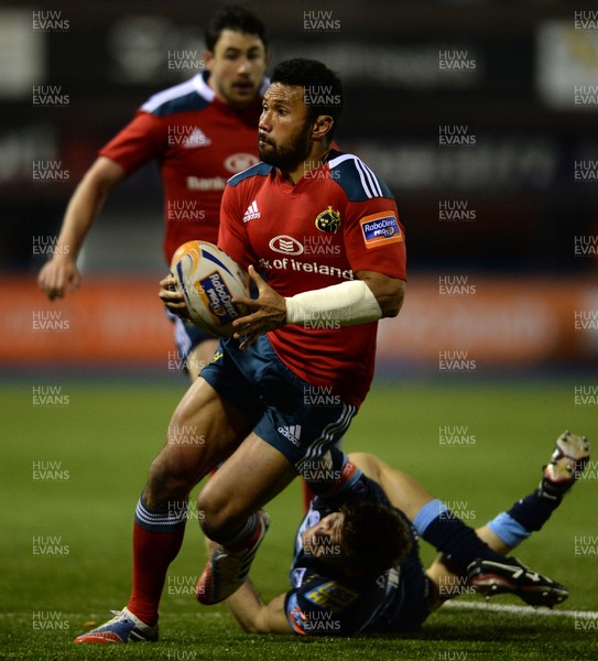 231113 - Cardiff Blues v Munster - RaboDirect PRO12 -Casey Laulala of Munster is tackled by Gavin Evans of Cardiff Blues