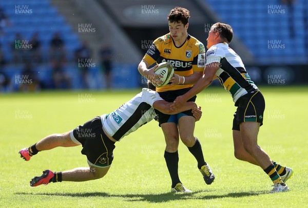 070816 - Singha Premiership Rugby 7s Series Final - Plate Semi Final - Cardiff Blues v  Northampton Saints - Owen Jenkins of Cardiff Blues is tackled by Will Glover and George Furbank of Northampton