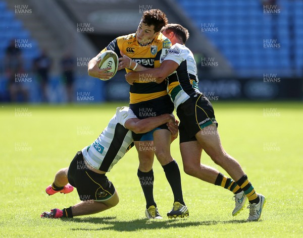 070816 - Singha Premiership Rugby 7s Series Final - Plate Semi Final - Cardiff Blues v  Northampton Saints - Owen Jenkins of Cardiff Blues is tackled by Will Glover and George Furbank of Northampton