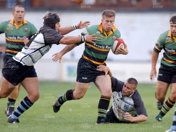 290803 - Cardiff Blues v Northampton Saints - Preseason Friendly - Cardiff's Robin Sowden-Taylor (L) tries to grab Chris Hyndman