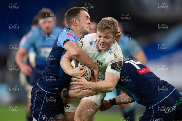 010121 - Cardiff Blues v Ospreys - Guinness PRO14 - Kieran Williams of Ospreys is tackled by Luke Scully of Cardiff Blues and Josh Adams of Cardiff Blues